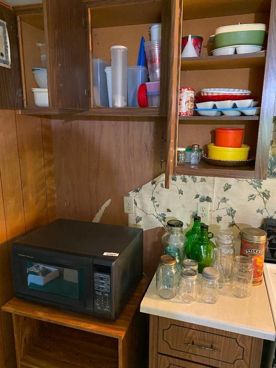 Microwave, glassware and contents of three cabinets