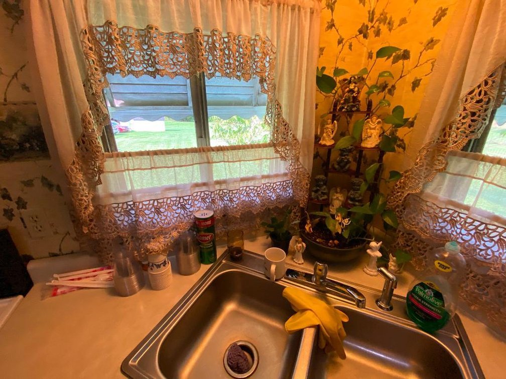 Contents of three cabinets, plant stand and figurines