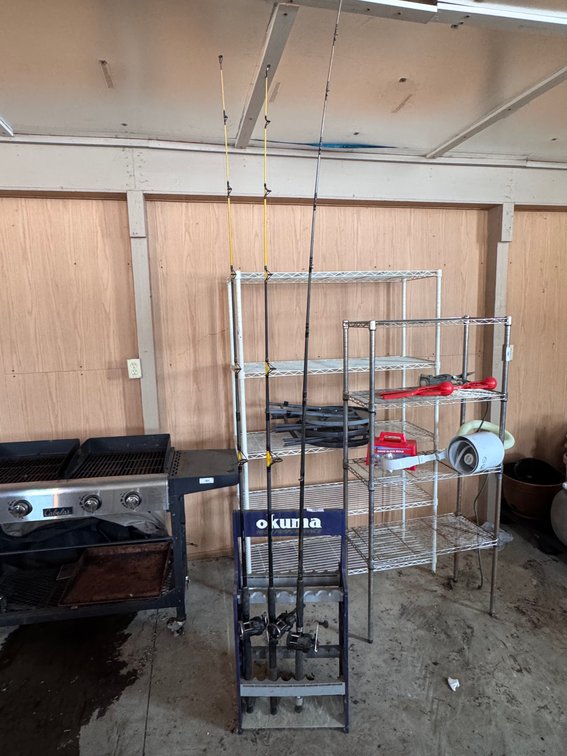 Three bait casters with stand