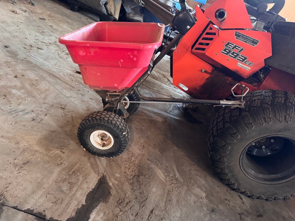 Pull behind spreader