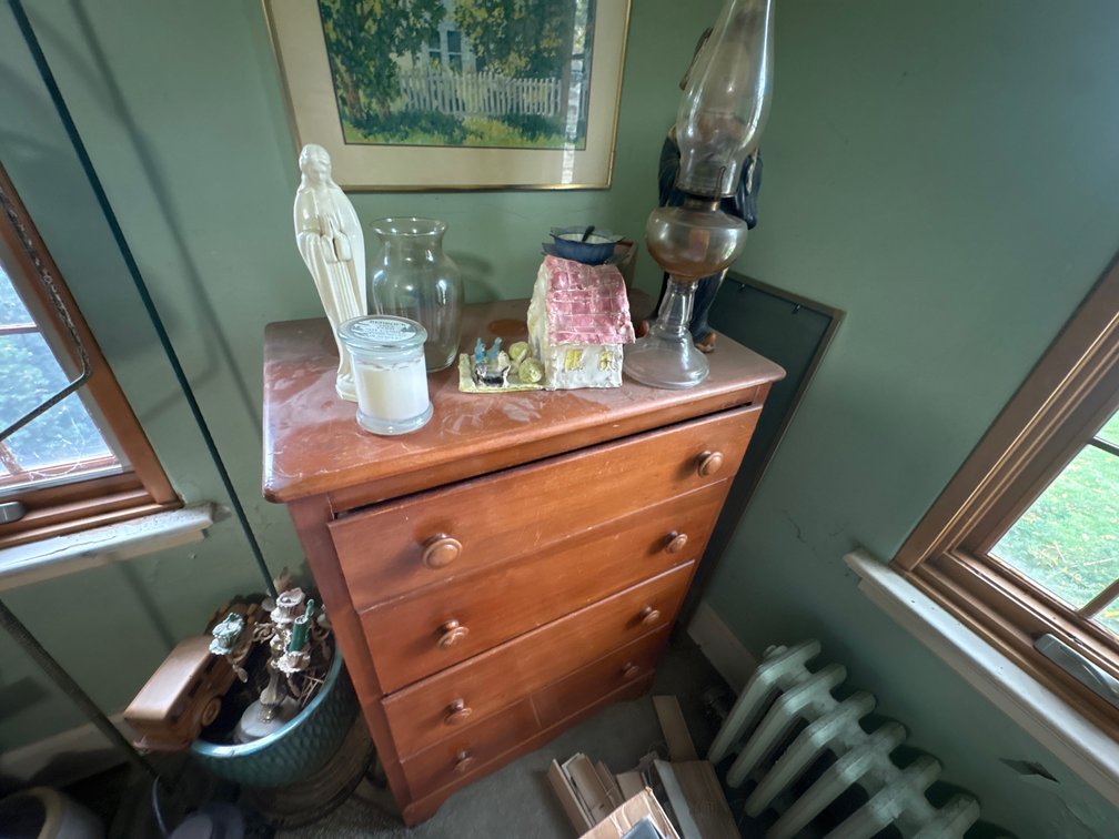 Wooden Four-Drawer Chest, Glass Oil Lamp, and Figurines