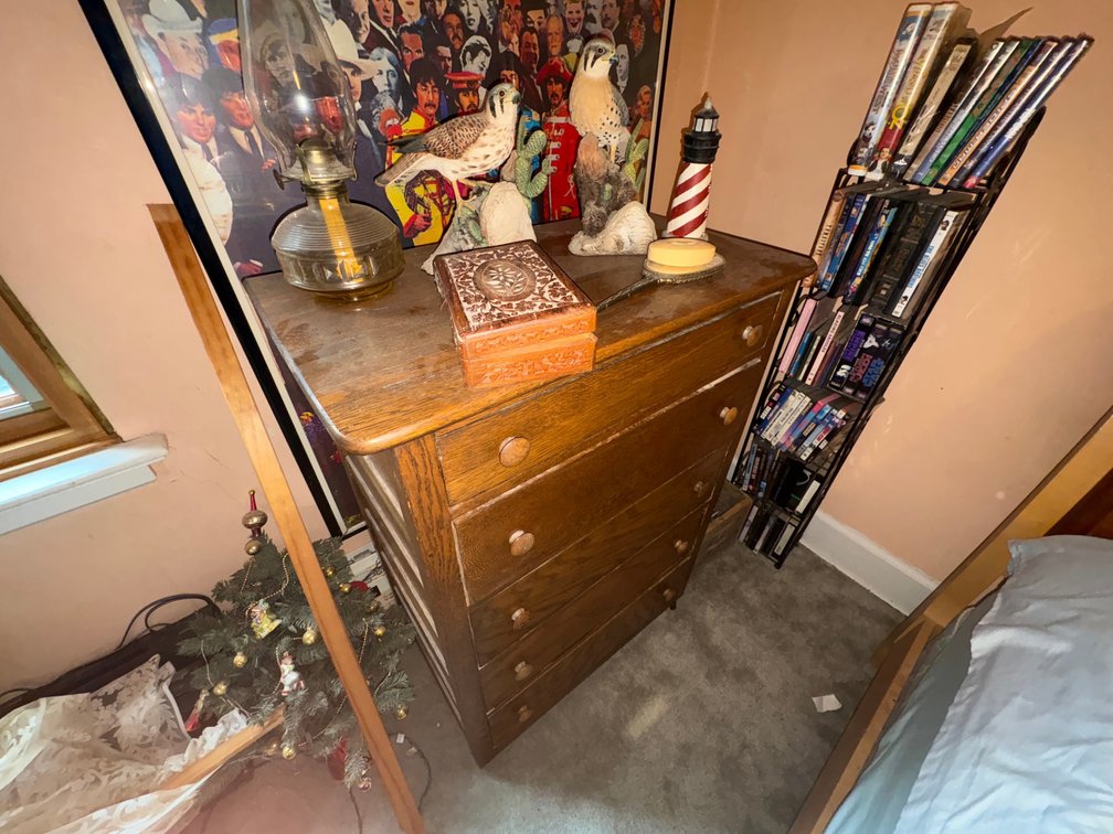 Oak Five-Drawer Chest, Framed Beatles Poster, and Tabletop Decor