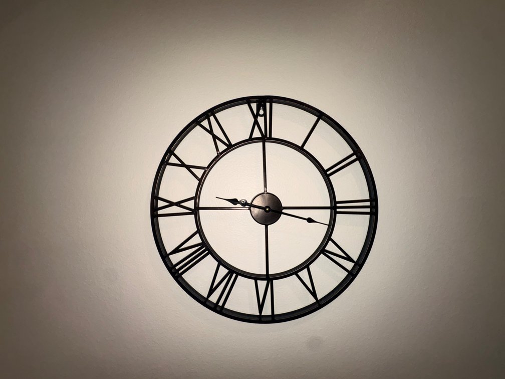 Black Metal Skeleton Roman Numeral Wall Clock