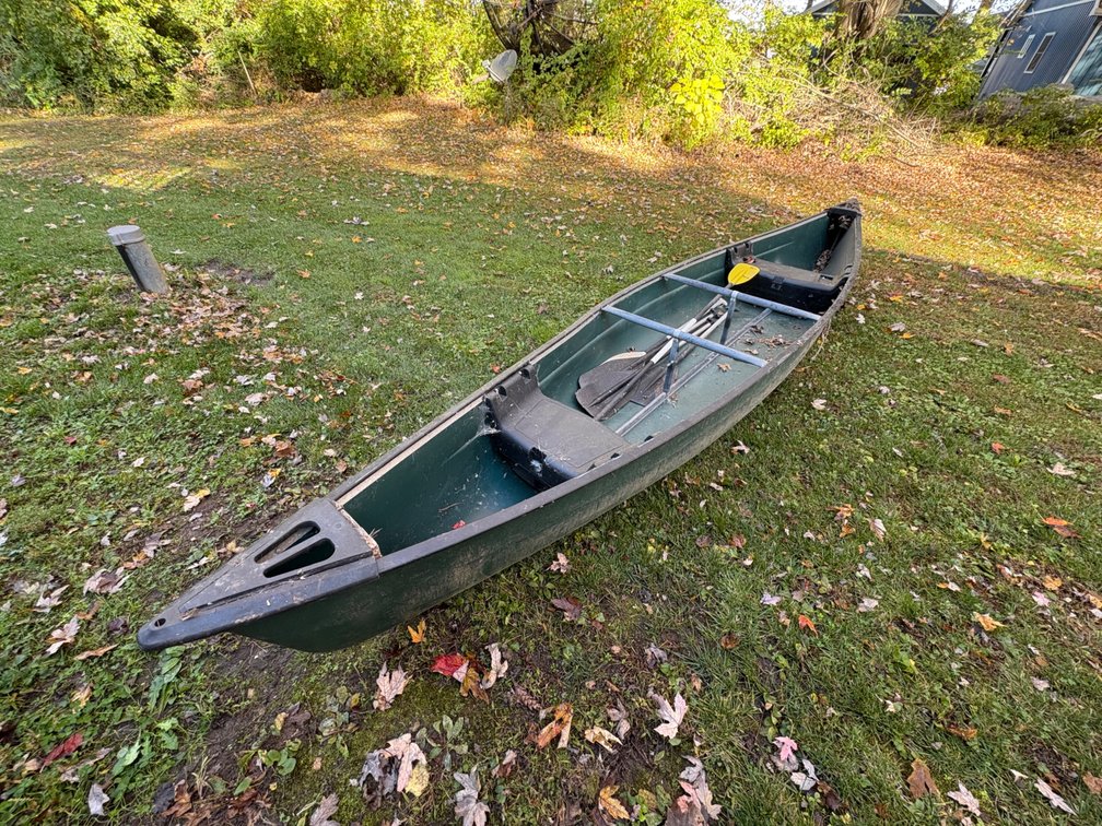 Dark Green Molded Plastic Canoe with Paddle