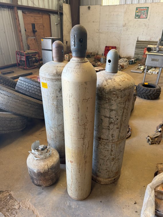 Lot of (3) Gas Cylinders and 1 Propane Tank - Located in Front Portion of Main Shop