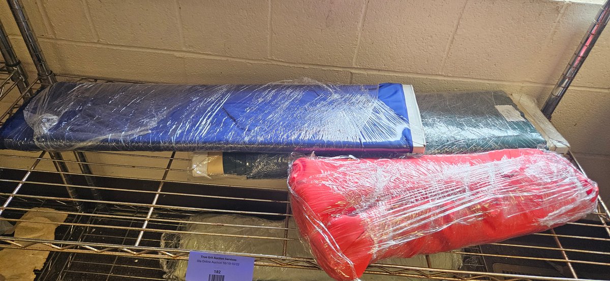 Fabric Bolts and Rolls in Blue, Red, and Teal