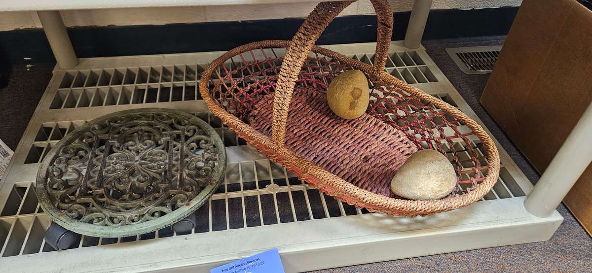 Cast Metal Plant Caddy, Woven Basket, and Stones