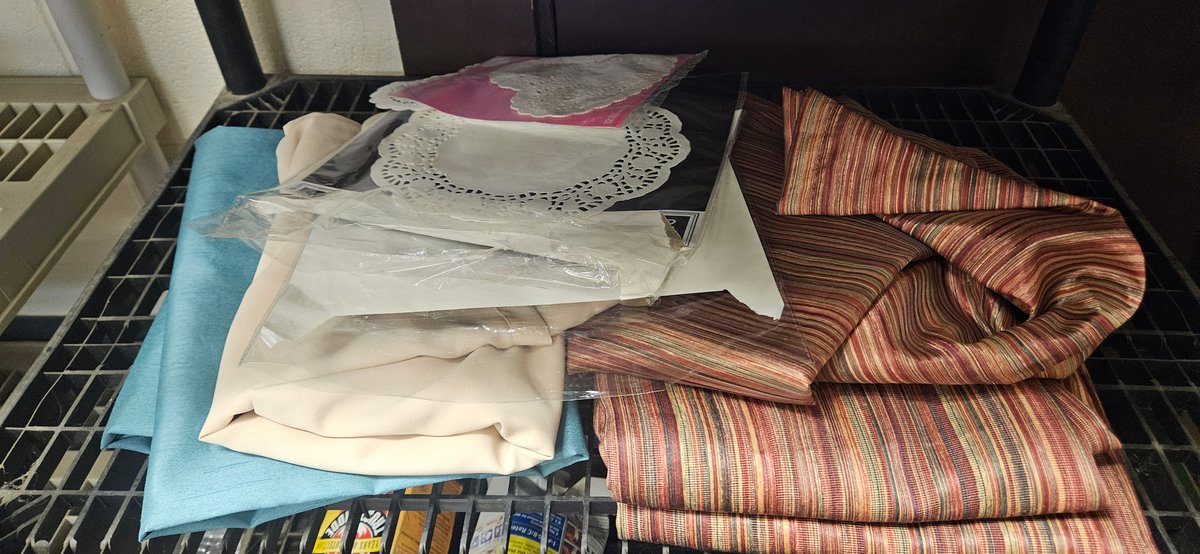 Folded Fabrics and Packaged Paper Lace Doilies