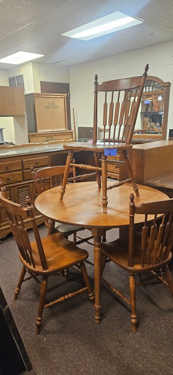 Round Wood Dining Table and Four Spindle-Back Chairs