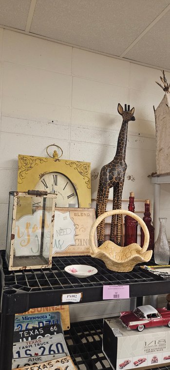 Wall Clock, Carved Giraffe Statue, Lantern, and Glassware