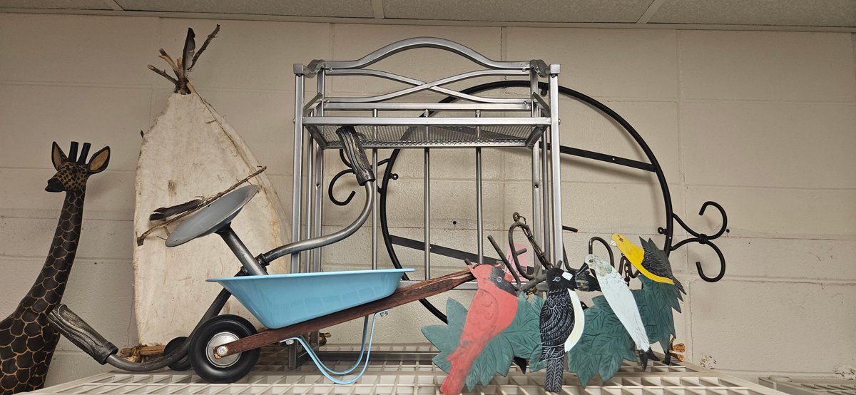 Metal Wire Rack, Decorative Wheelbarrow, and Garden Accents