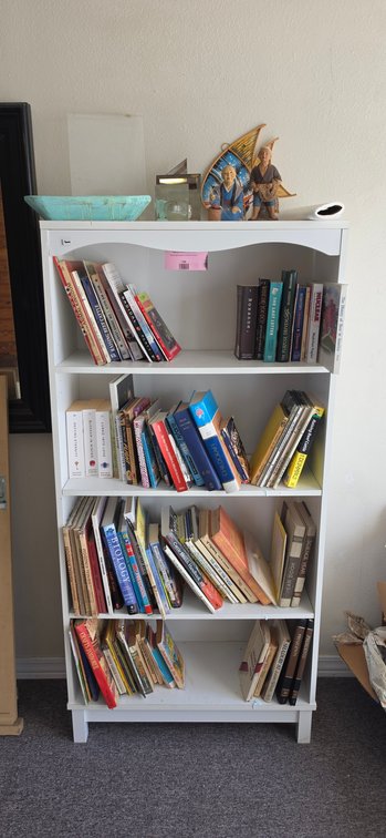 White Four-Shelf Bookcase with Books and Home Decor