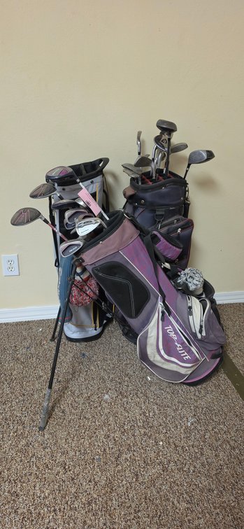 Three Golf Bags with Golf Clubs