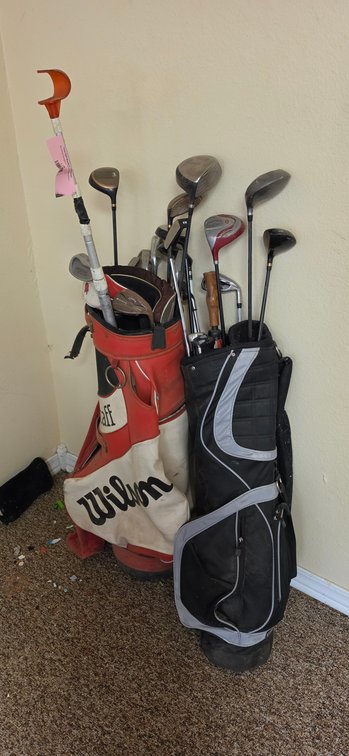 Two Golf Bags with Golf Clubs and Ball Retriever