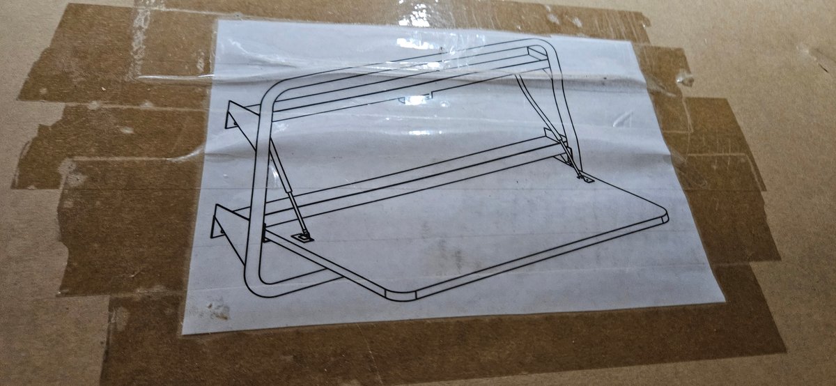 Wall-Mounted Fold-Down Desk in Shipping Carton