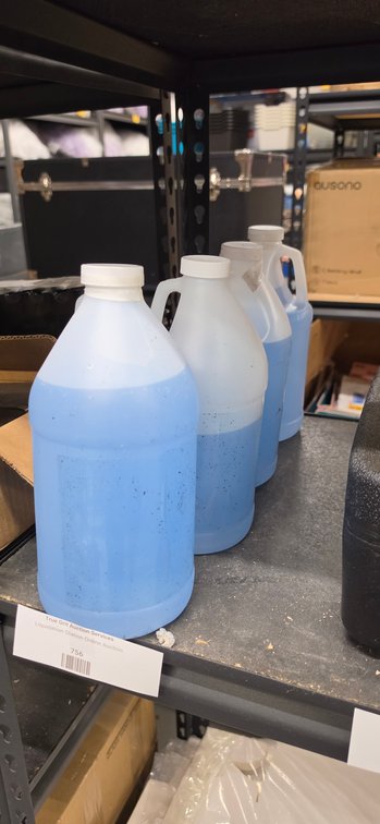 Translucent Plastic Jugs with Light Blue Liquid