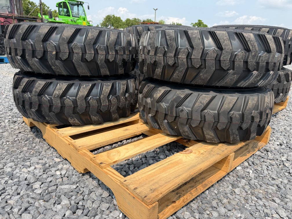 (4) New 10-16.5 SKS-1 Skid Loader Tires w/ Rims