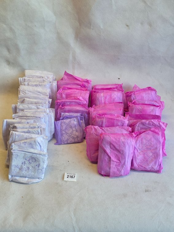Assorted Sanitary Pads in Pink and White Packaging