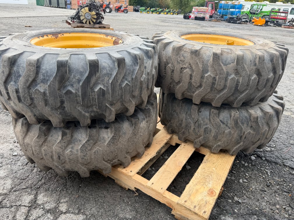 Skid Lot Of (4) 12-16.5 Skid Loader Tires W/ Rims