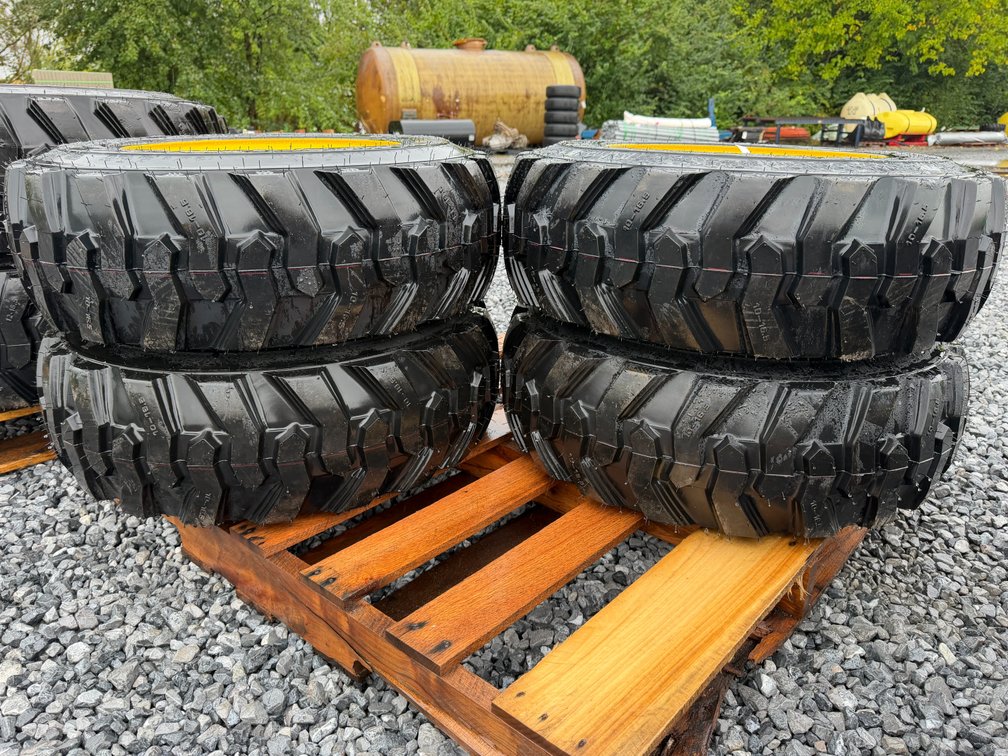 New Set Of (4) 10-16.5 NHS Skid Loader Tires W/Rim
