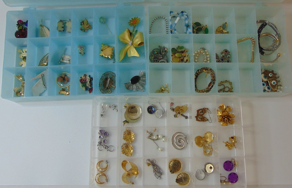 Variety of Costume Jewelry in plastic storage cases (3-cases).