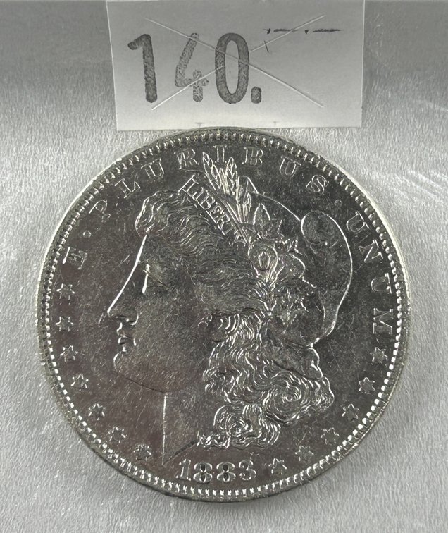 1883 Morgan Dollar AU.