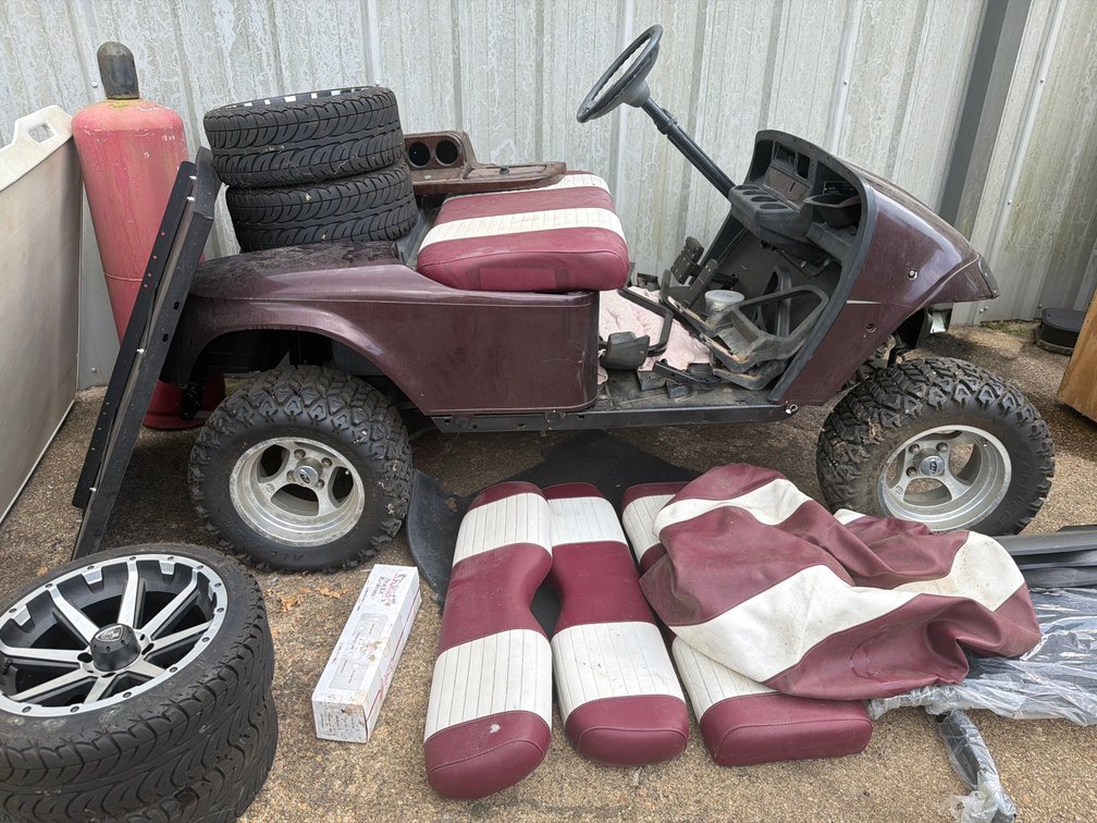 Lifted Golf Cart with Spare Wheels, Tires, and Parts