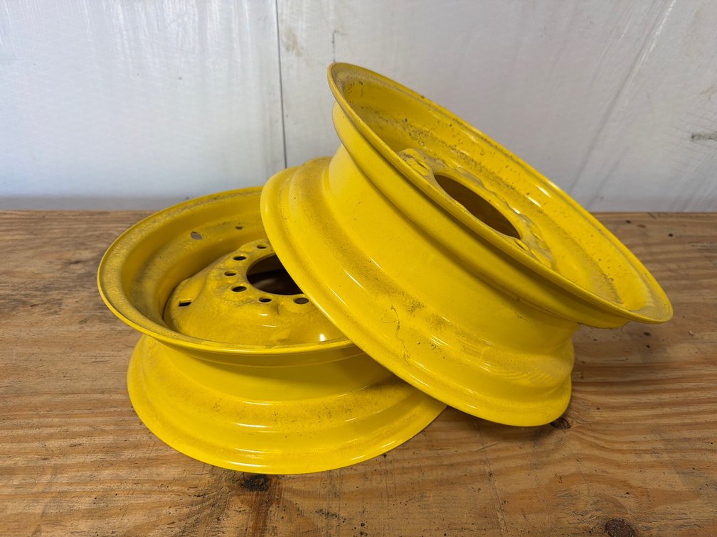 Two Yellow Steel Wheel Rims