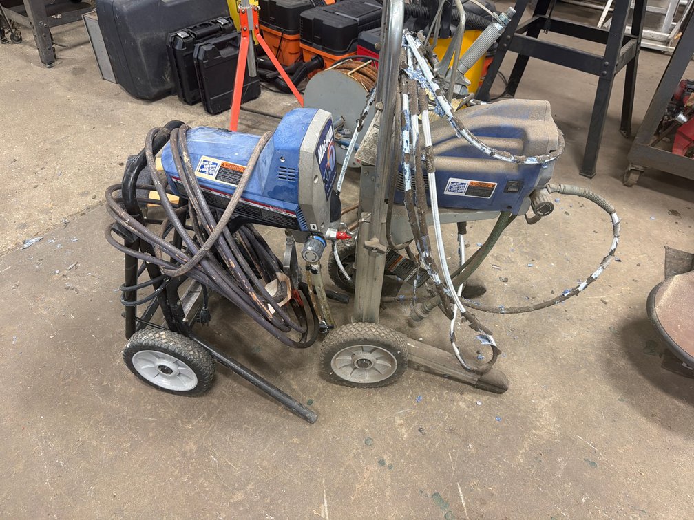 Two Graco Magnum Airless Paint Sprayers on Carts