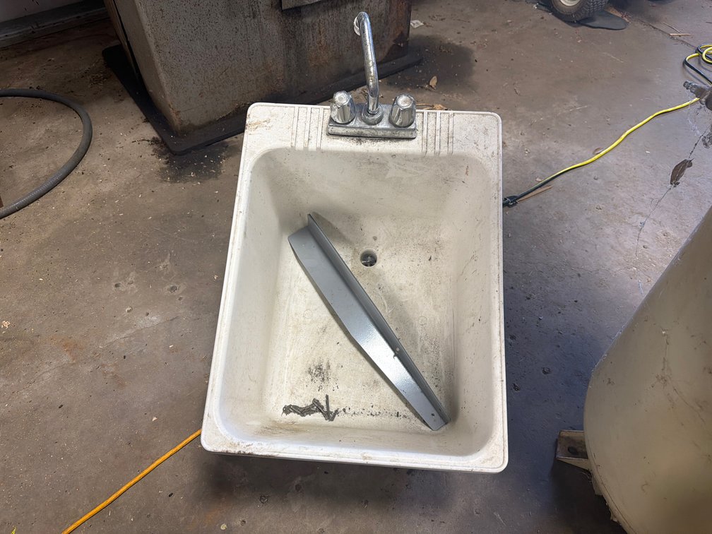 White Utility Sink with Faucet and Metal Wire Rolling Cart