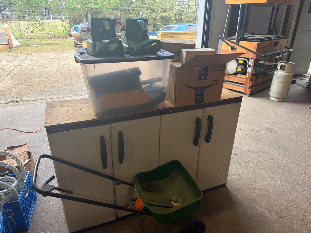 Utility Cabinet Workbench, Lawn Spreaders, Paint Brushes, and Hardware Supplies