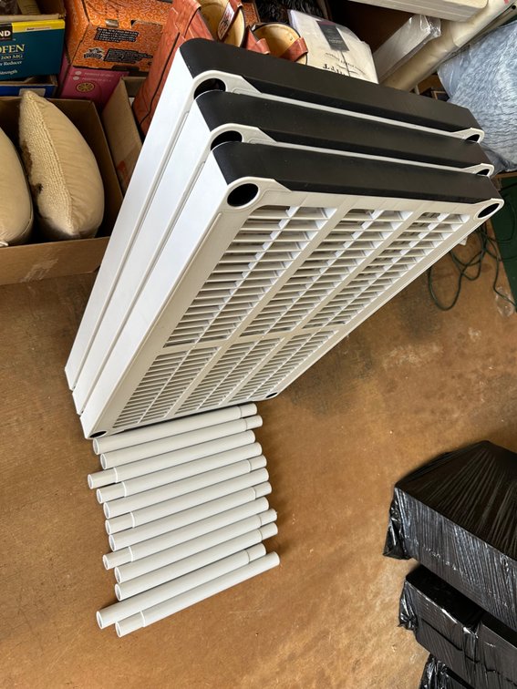 Disassembled Durable Plastic Shelves and Legs