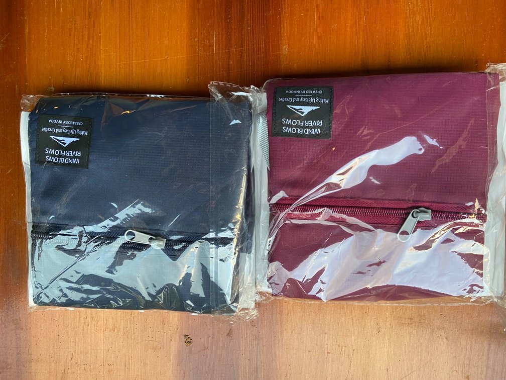 Two folding ripstop, nylon travel, duffel bags