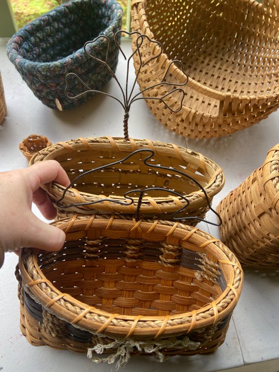 Two baskets with metal hangars handmade by Alaska artist