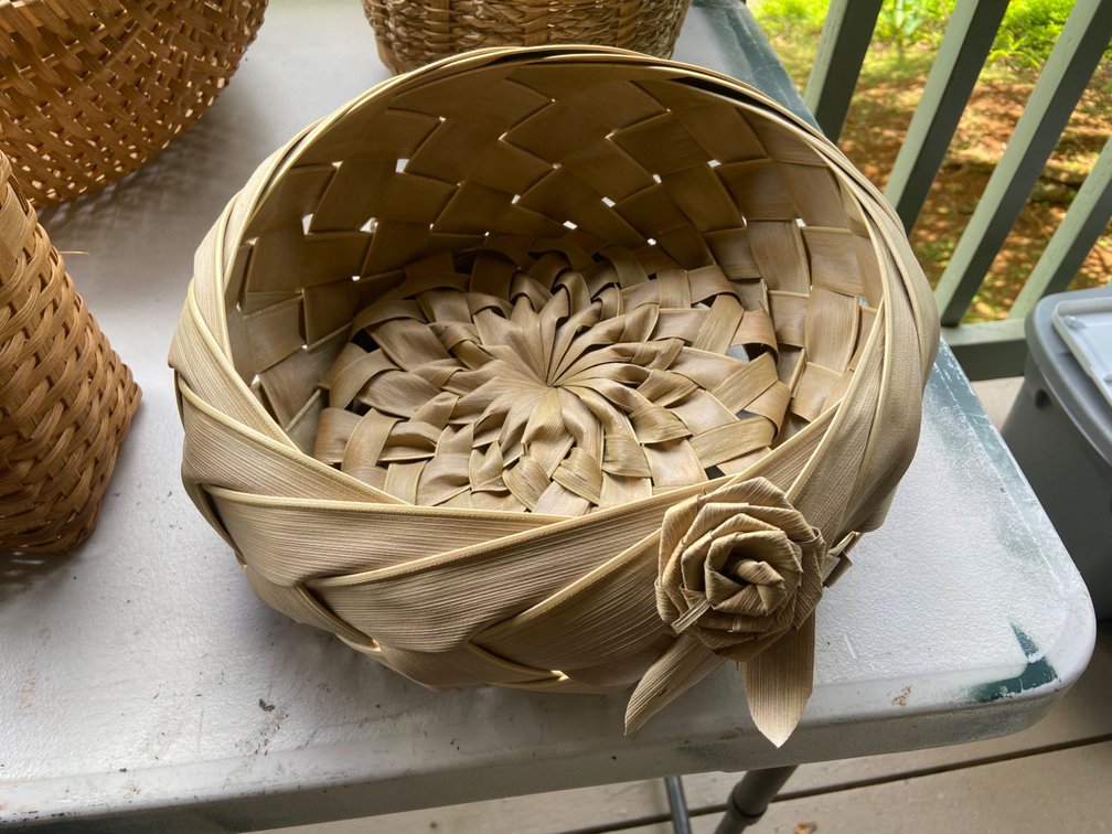 Round basket with embellishment by Alaskan Artist