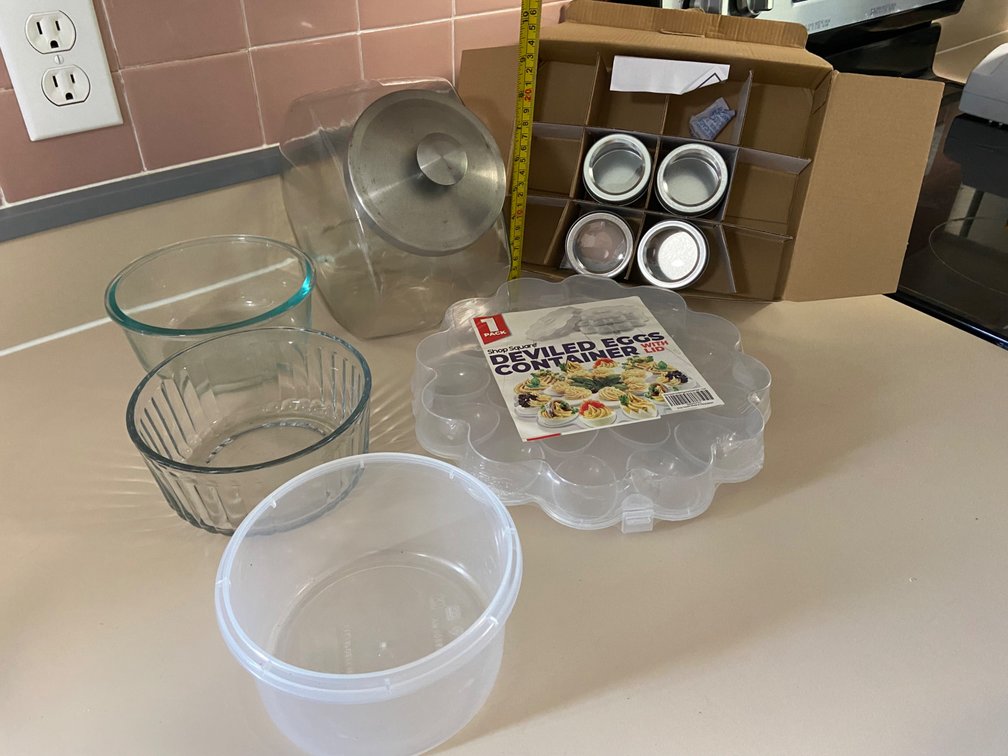 Lot of assorted storage item for kitchen, cookie jar, deviled egg holder for spice containers, and three assorted storage bowls