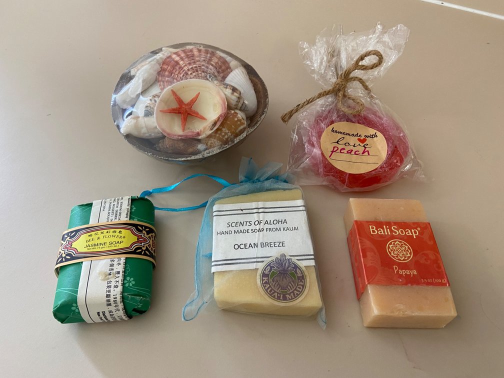 Assortment of soaps and Packaged shells in coconut shell