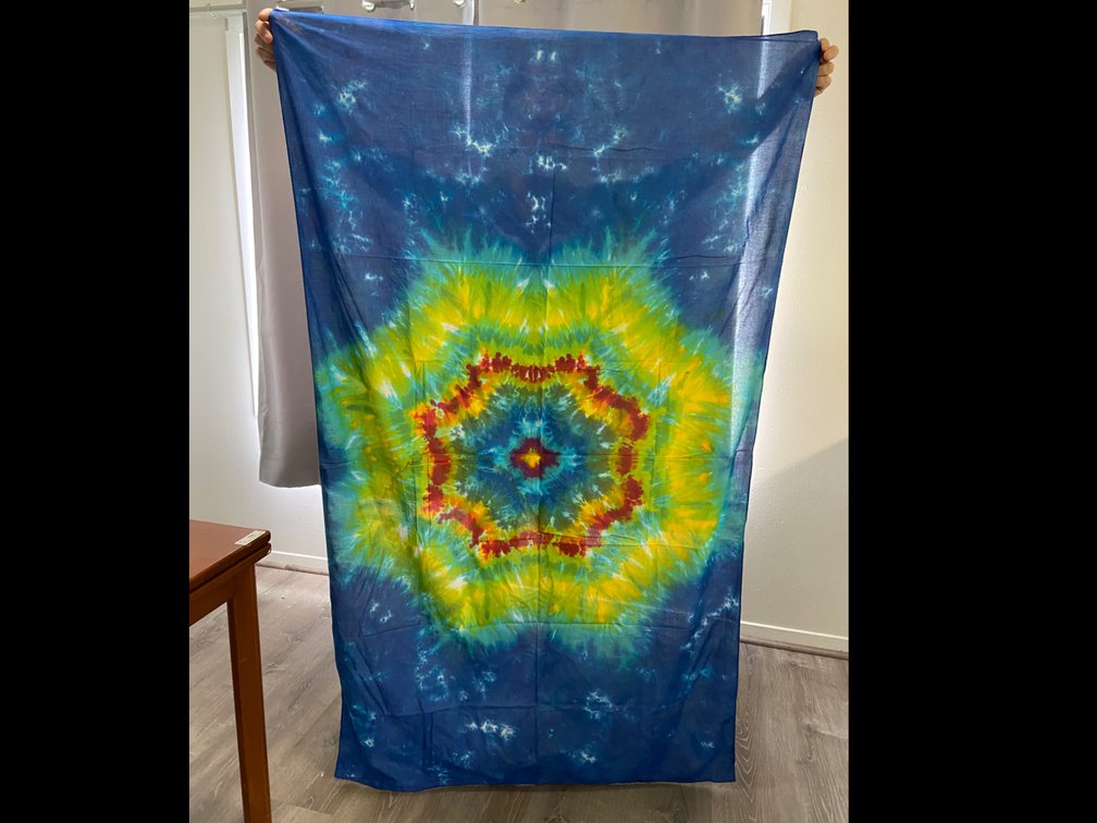 Brightly colored hand, tie-dyed Cotton sarong with yellow mandala