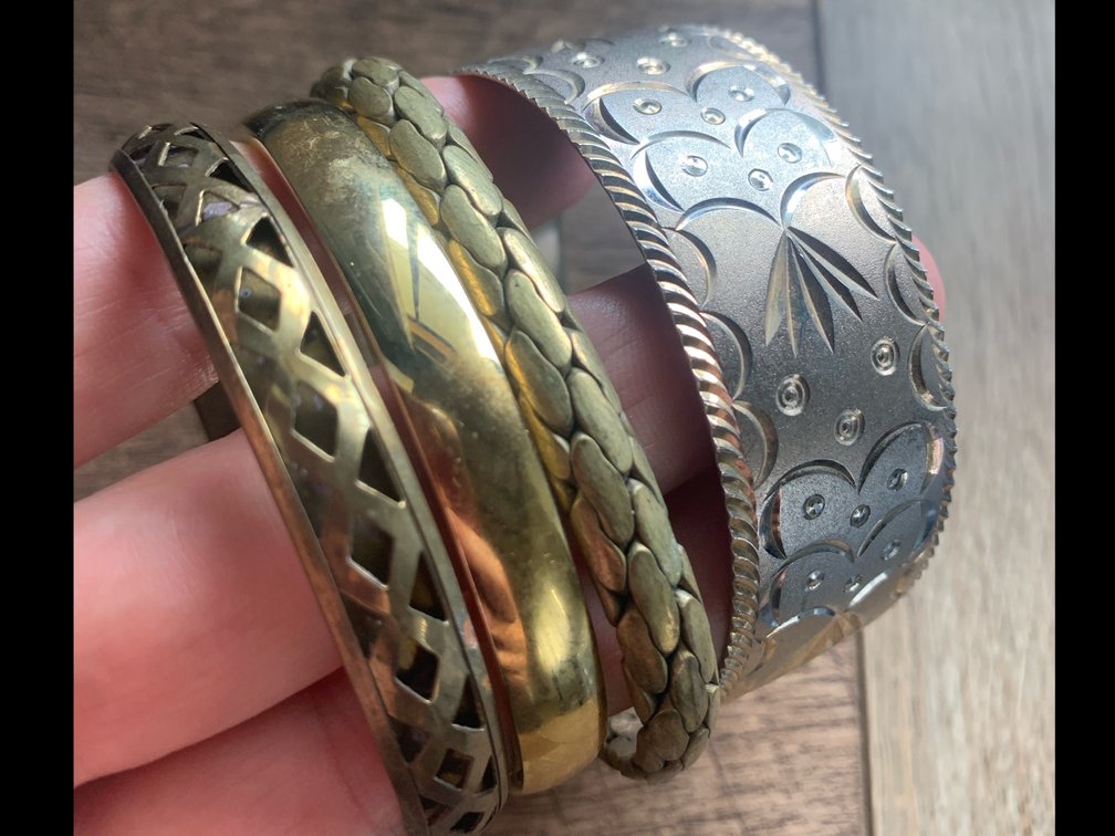 Collection Of Bracelets In Brass Tones 