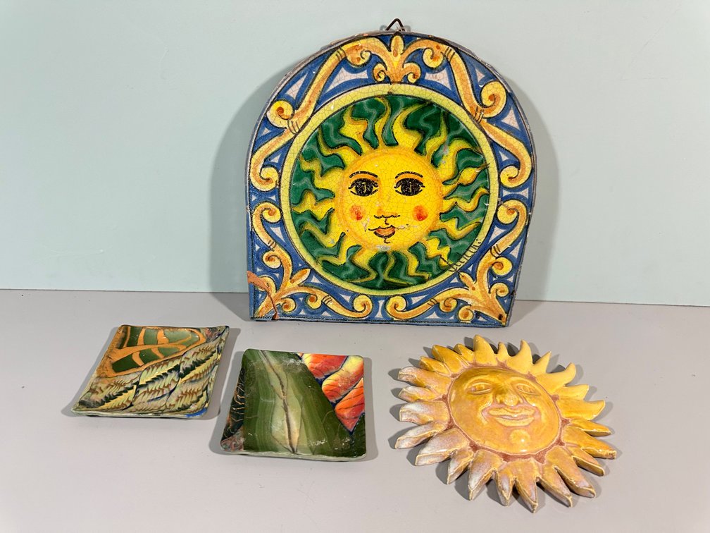 Collection of Decorative Sun-Themed Ceramic and Enamel Pieces