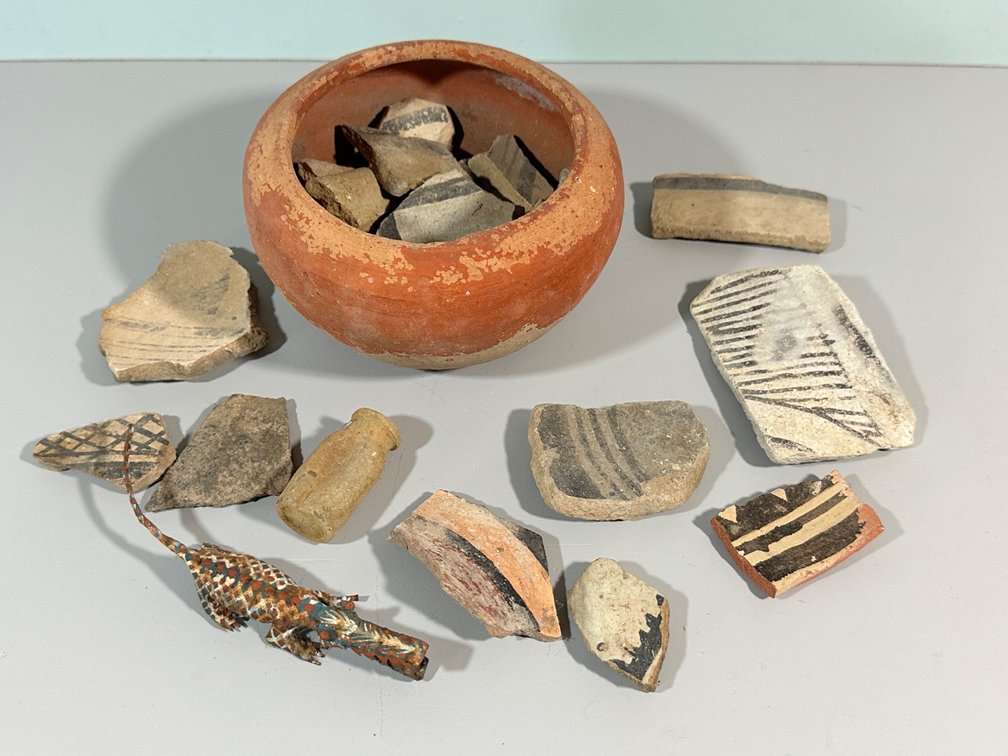 Collection of Ancient Pottery Shards and Artifacts