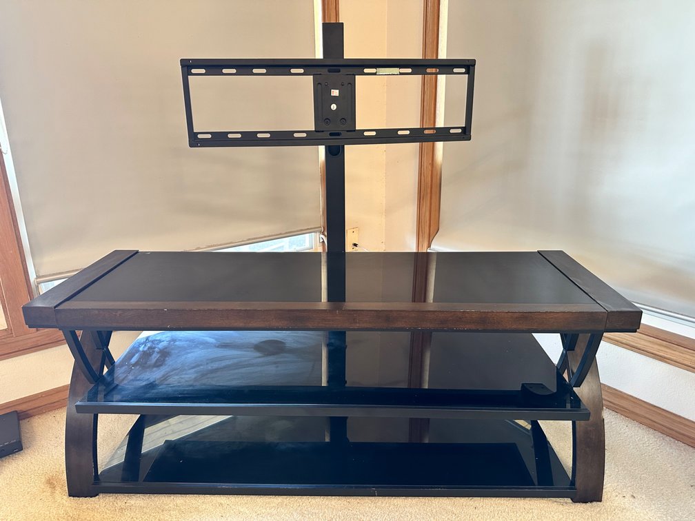 Elegant Wooden TV Stand with Integrated Mount and Glass Shelves