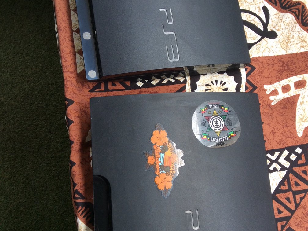 Pair of PlayStation 3 plugged in powers on