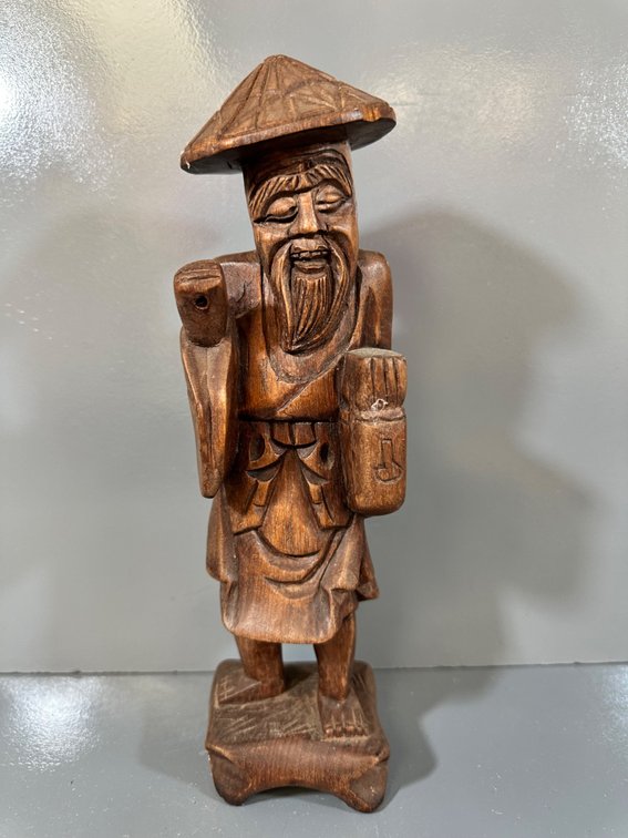 Carved Wooden Figurine of a Bearded Man with Lantern