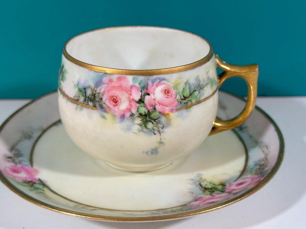 Elegant Hand-Painted Tea Cup and Saucer Set with Gold Accents from The Guslander Estate
