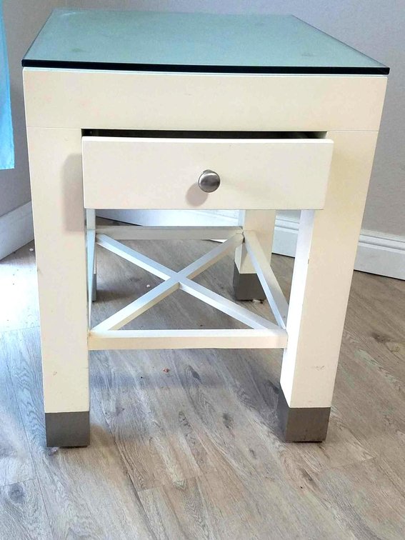 26 1/2" high, 20" wide, 24" deep.  Off white side table/night stand with glass top. 
