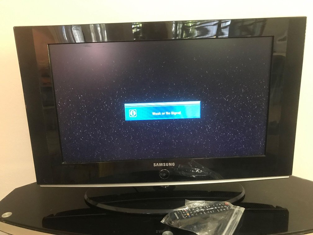 Samsung TV.  Powers on. (Powers up but no cable connection here) 31" inches diagonal)  With remote