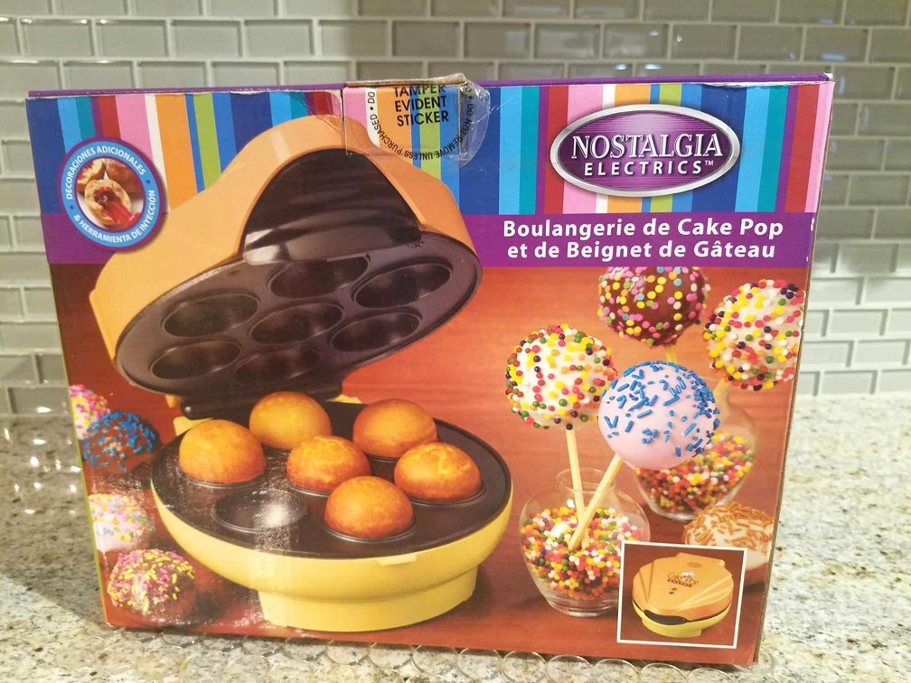 Nostalgia Donut Hole and Cake Pop Maker with 60 Wilton Cake pop sticks in package. still in box