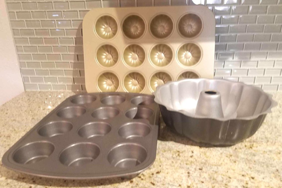 Three baking pans including bundt pan
