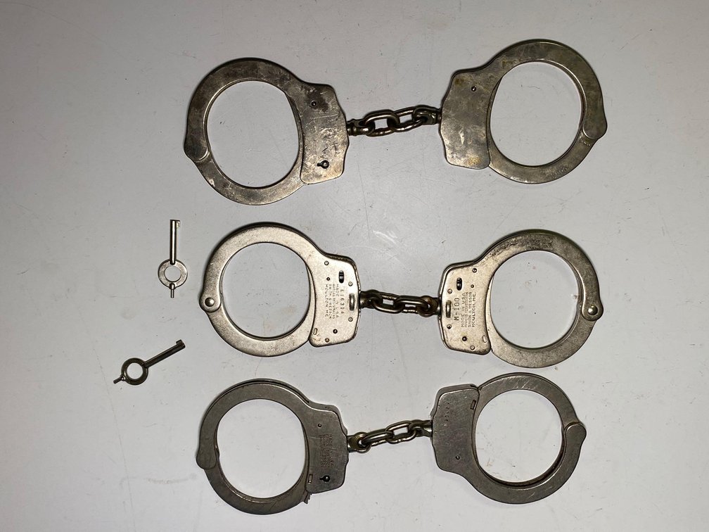 (X's 3) Smith & Wesson (England) and Clejuso Edelstahl Rostfrei Handcuffs